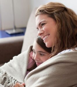 mother and daughter snuggling